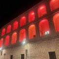 Il Palazzo di Città di Bisceglie si illumina di rosso Adisco